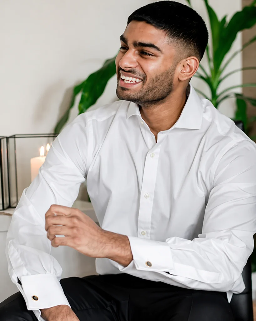 Smiling male practitioner or staff member at St Martins Podiatry wearing a white dress shirt